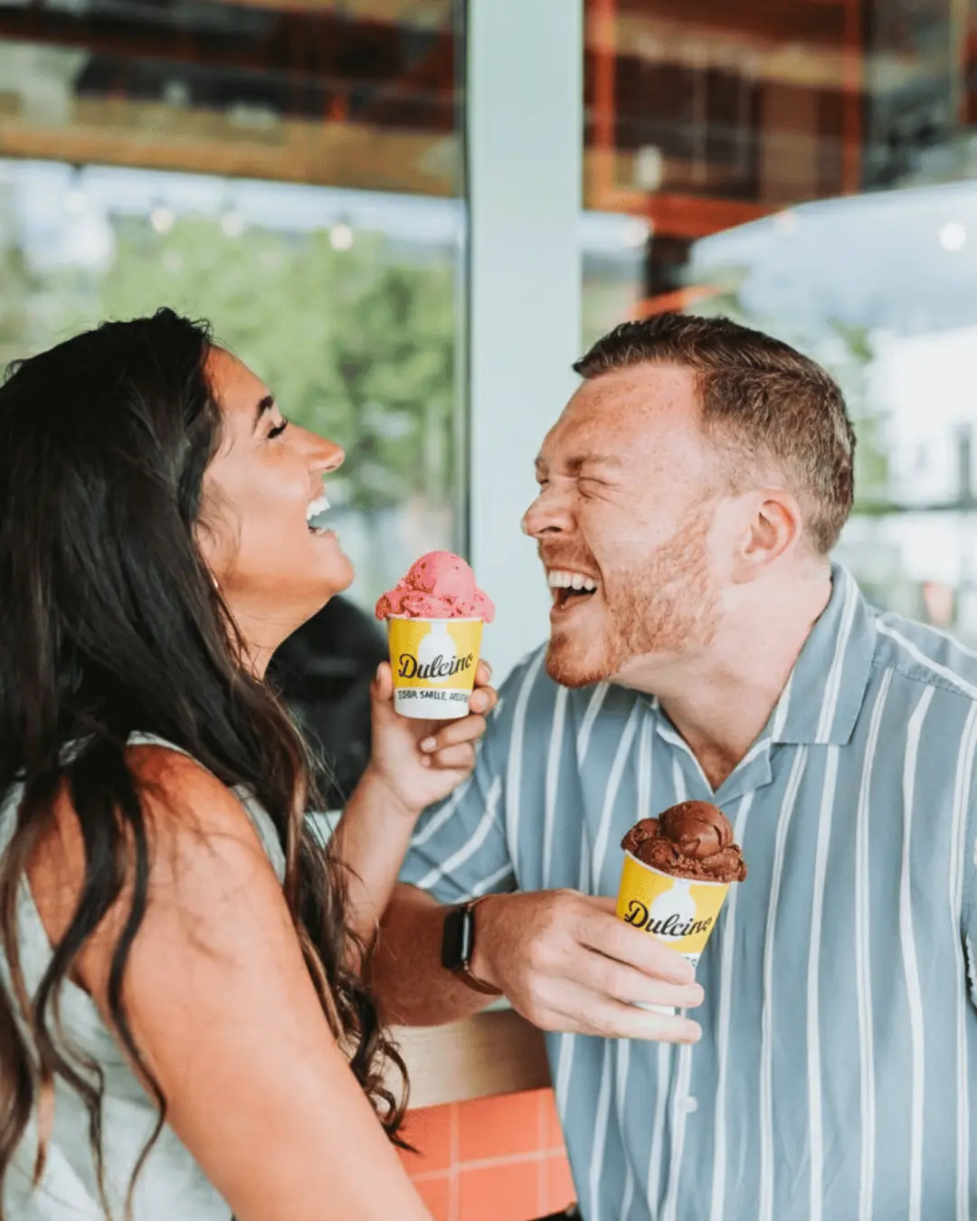 Dulcino Gelato campaign image featuring two customers with branded gelato cups
